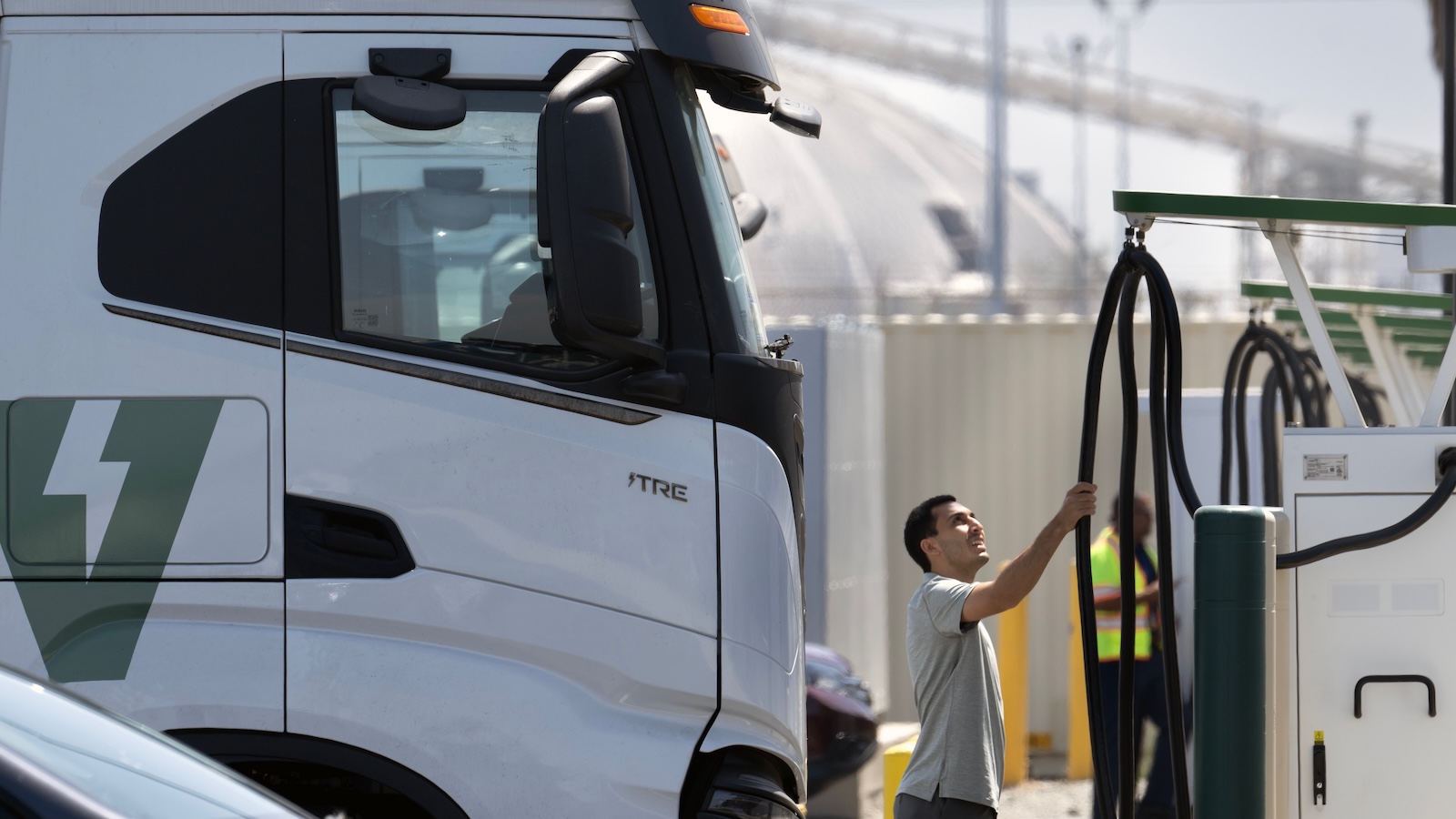 A truck driver prepares to plug in his big-rig at the Port of Long Beach.
