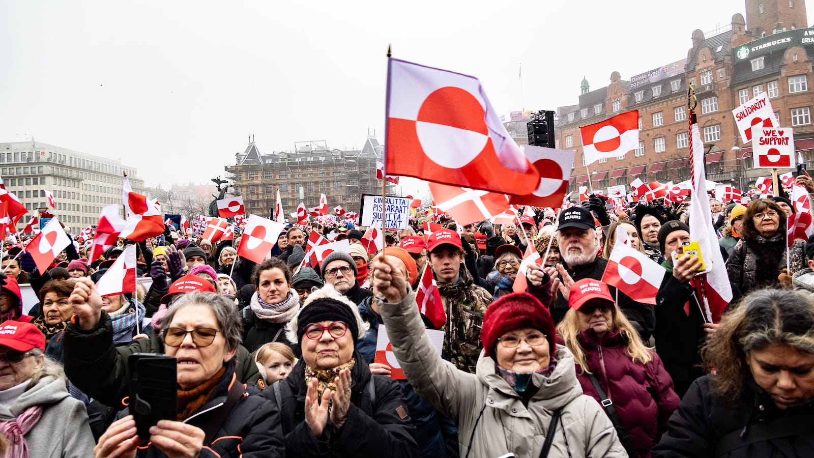 Protesters wave Greenland flags during a demonstration under the slogans 'hands off Greenland' and 'Greenland for Greenlanders' at City Hall Square in Copenhagen, Denmark, on January 17, 2026.