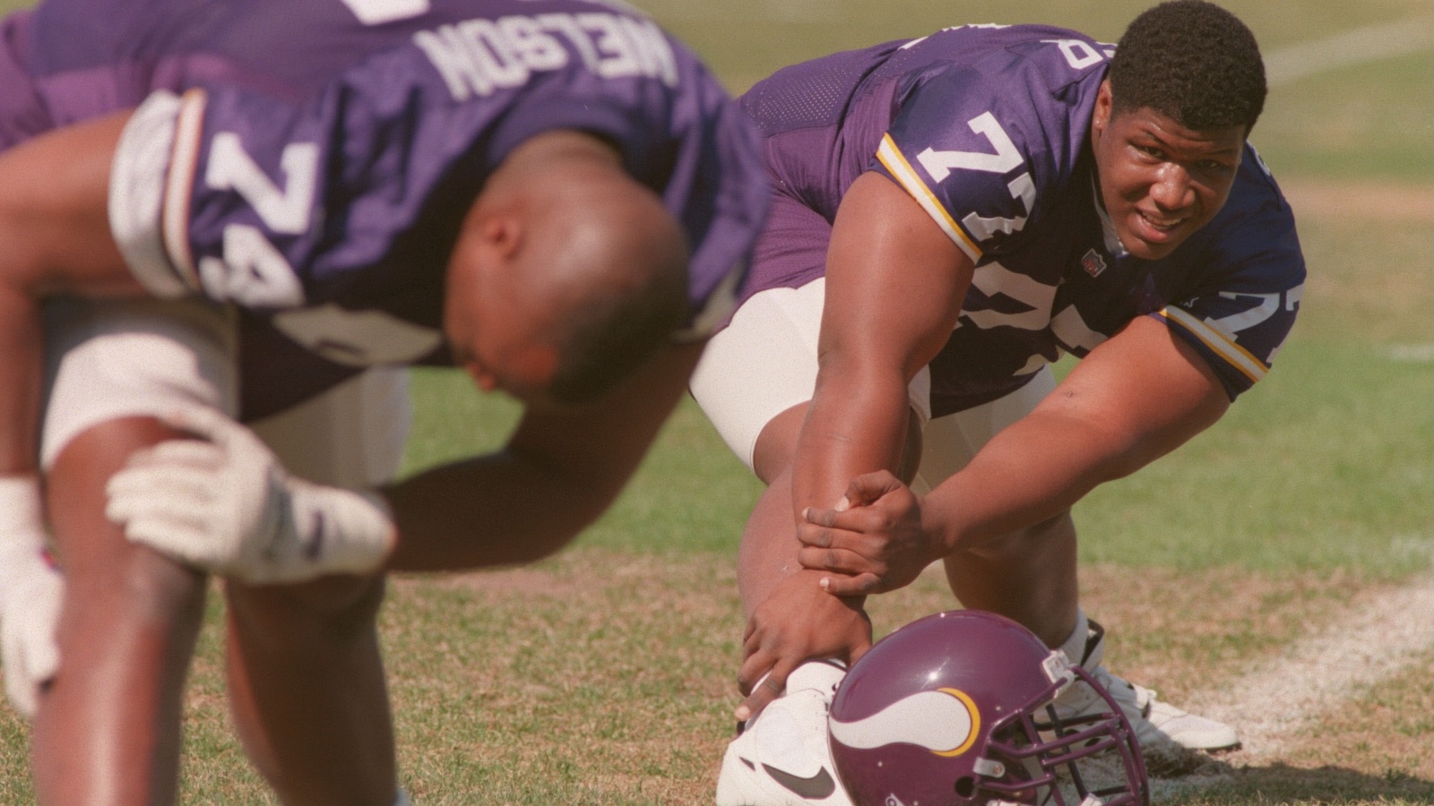 The late Korey Stringer, a lineman with the Minnesota Vikings football team, is shown stretching before a workout in a photo from 1995.