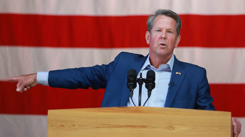 Georgia Gov. Brian Kemp speaks at a campaign event attended by former U.S. Vice President Mike Pence at the Cobb County International Airport on May 23, 2022 in Kennesaw, Georgia. Kemp is running for reelection against former U.S. Sen. David Perdue in tomorrow's Republican gubernatorial primary.