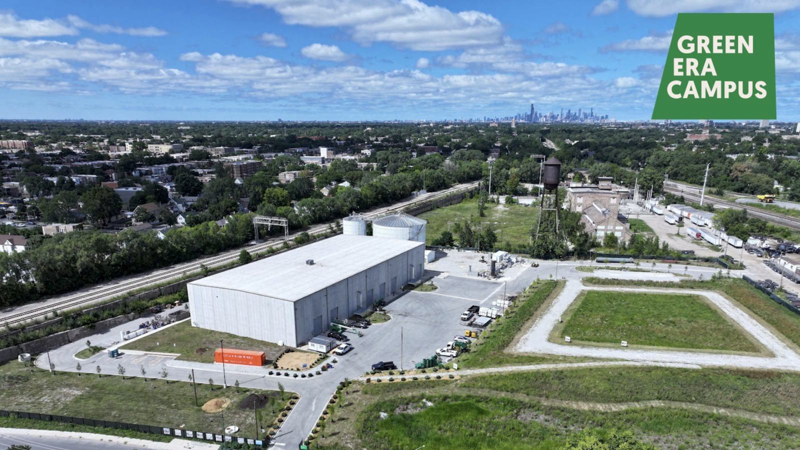 An aerial photo shows the plot of land from the previous images, now green, with a large white composting facility