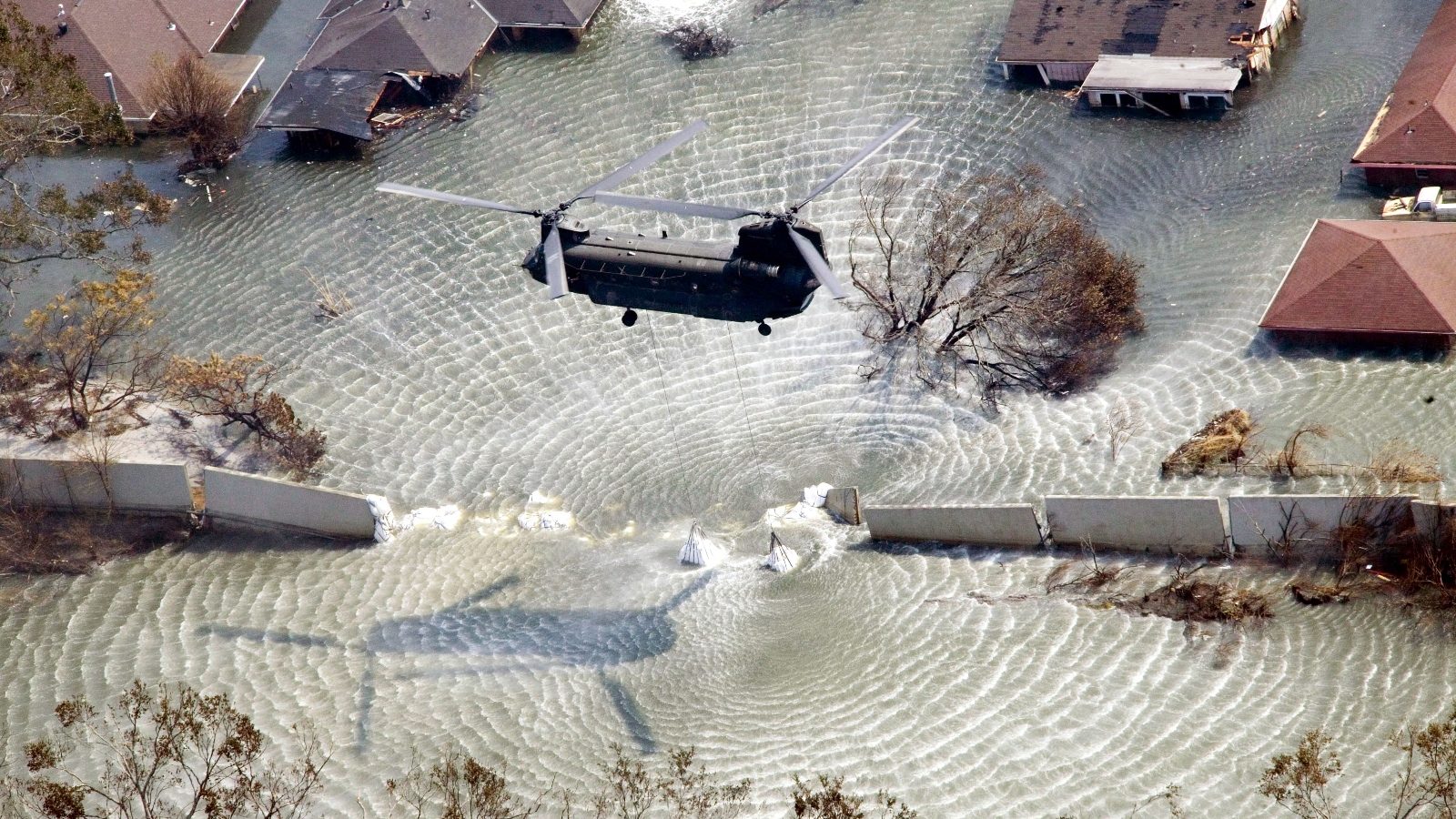 A Chinook helicopter drops sandbags into a breach along the London Avenue canal in New Orleans during Hurricane Katrina. After the storm, the Corps of Engineers spent almost $ 1 billion to close the city's outfall canals and build stronger walls alongside them.