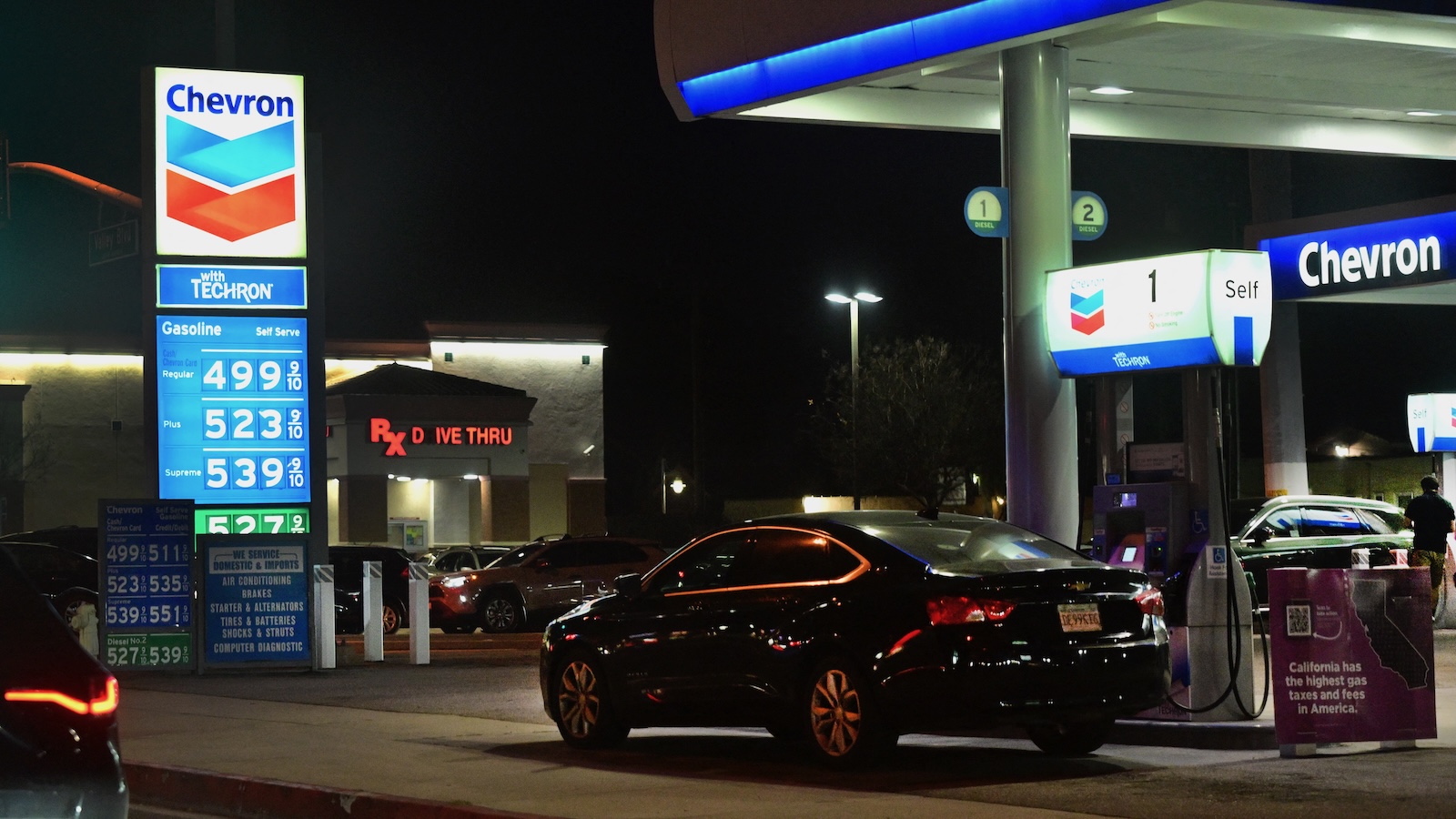 A sign with current gas prices is displayed at a gas station in Los Angeles, California on March 2, 2026.