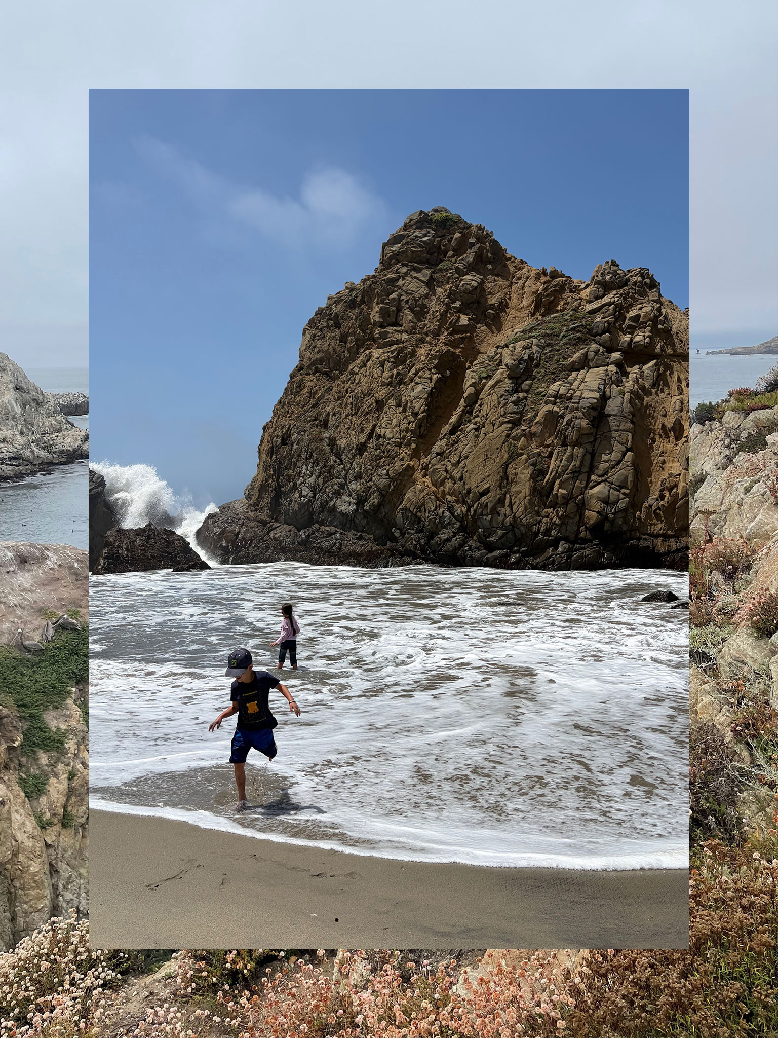 A collage consisting of two vertical photos, the outside functioning a border and the inside fully visible. The outside photo is a coastal trail and sea. The inner photo is two children playing in the surf near a rock formation with a spray of waves hitting in the corner.